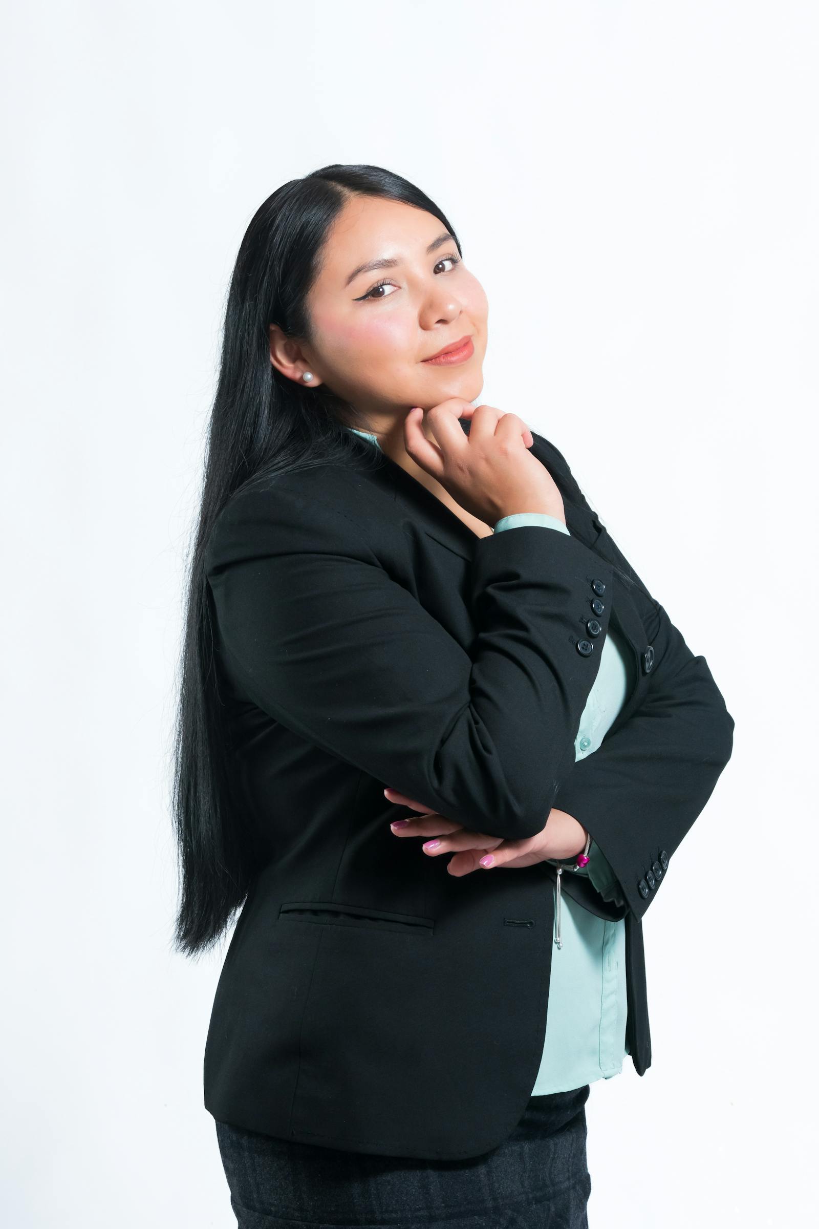 Studio portrait of Mira Halden, founder of Brivon, in a navy linen overshirt.